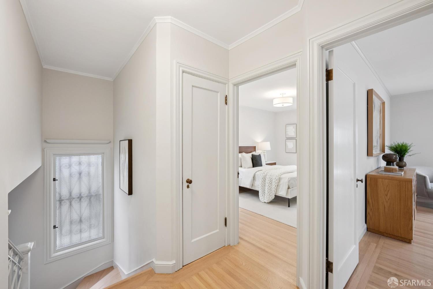 1867 15th Avenue San Francisco, CA 94122 - Photo 32 of 75 a view of a bedroom with a bed and wooden floor