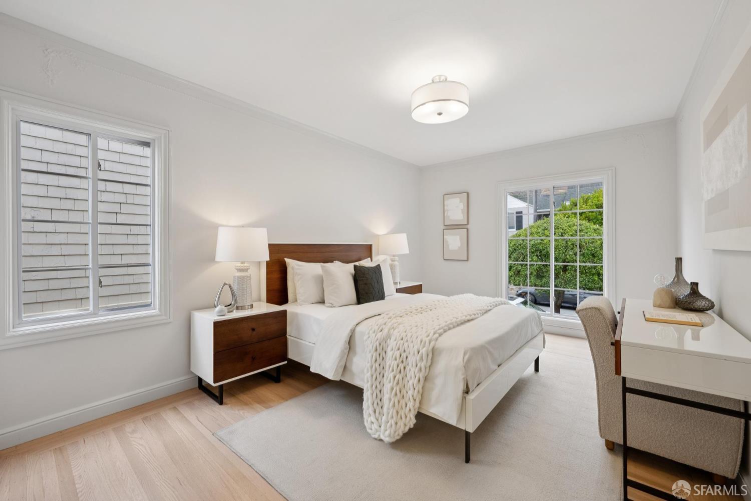 1867 15th Avenue San Francisco, CA 94122 - Photo 33 of 75 a bedroom with a bed and a table