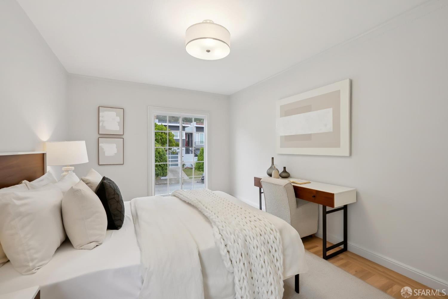 1867 15th Avenue San Francisco, CA 94122 - Photo 34 of 75 a bedroom with a bed and a window