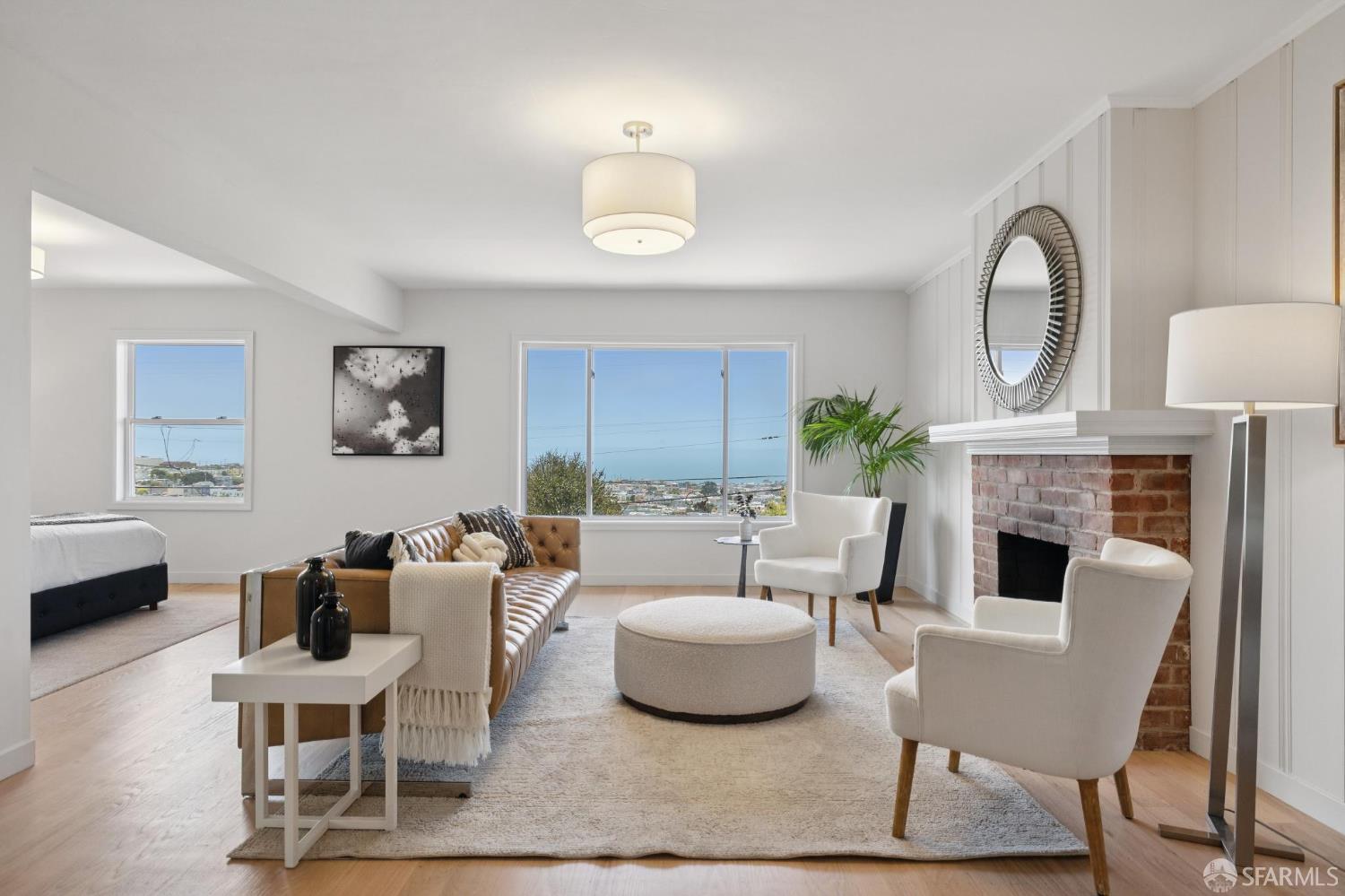 1867 15th Avenue San Francisco, CA 94122 - Photo 37 of 75 a living room with furniture a fireplace and a table