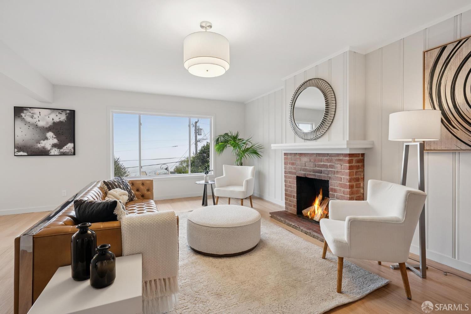 1867 15th Avenue San Francisco, CA 94122 - Photo 38 of 75 a living room with furniture and a fireplace