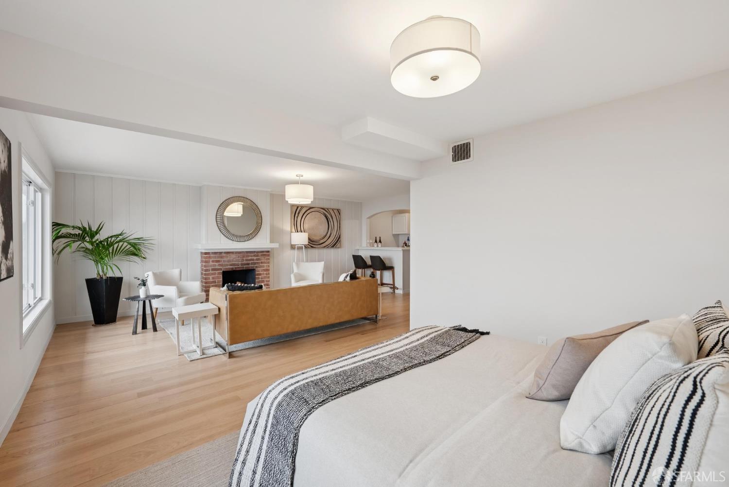 1867 15th Avenue San Francisco, CA 94122 - Photo 48 of 75 a bedroom with a bed and a chandelier