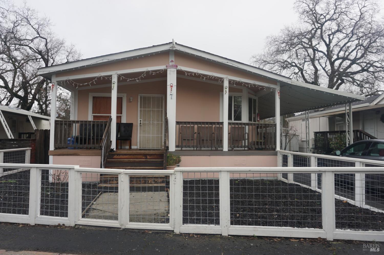 front view of a house with a large window