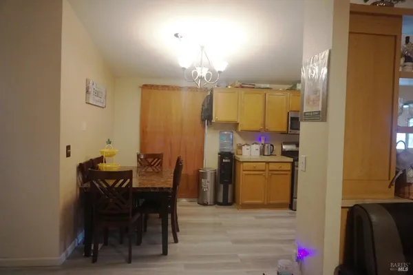 a dining room with furniture and window