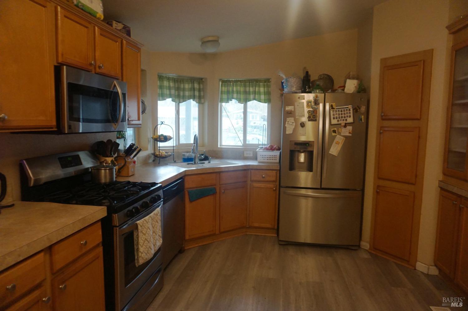 6004 Monticello Road, Unit 7 Napa, CA 94558 - Photo 13 of 33 a kitchen with a sink appliances and cabinets