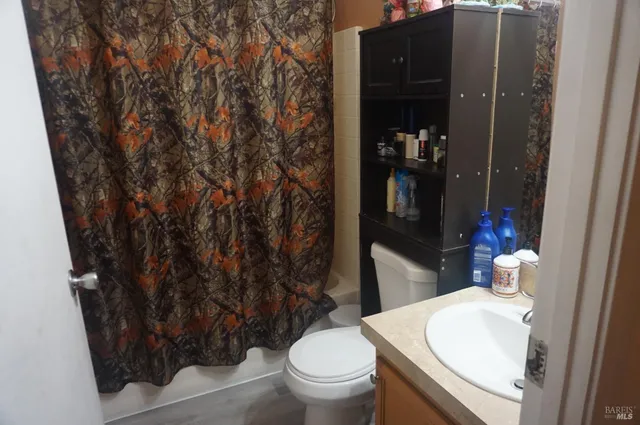 a bathroom with a toilet and a sink