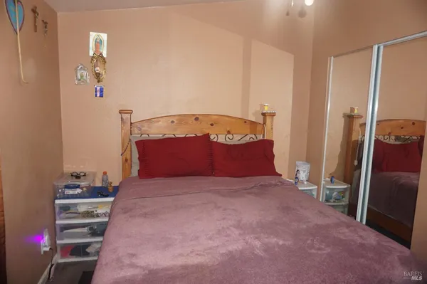 a bedroom with a bed and a closet