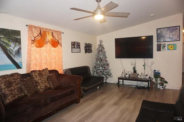 a living room with furniture and a flat screen tv