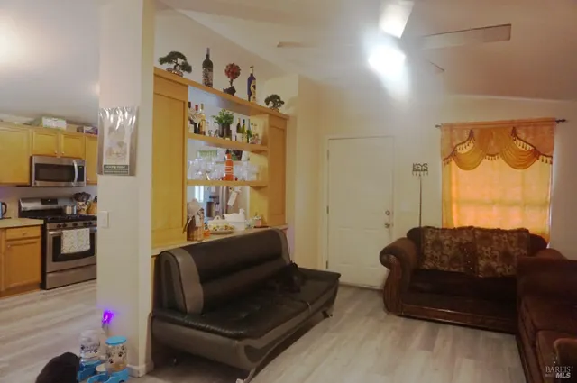 a living room with furniture and a window