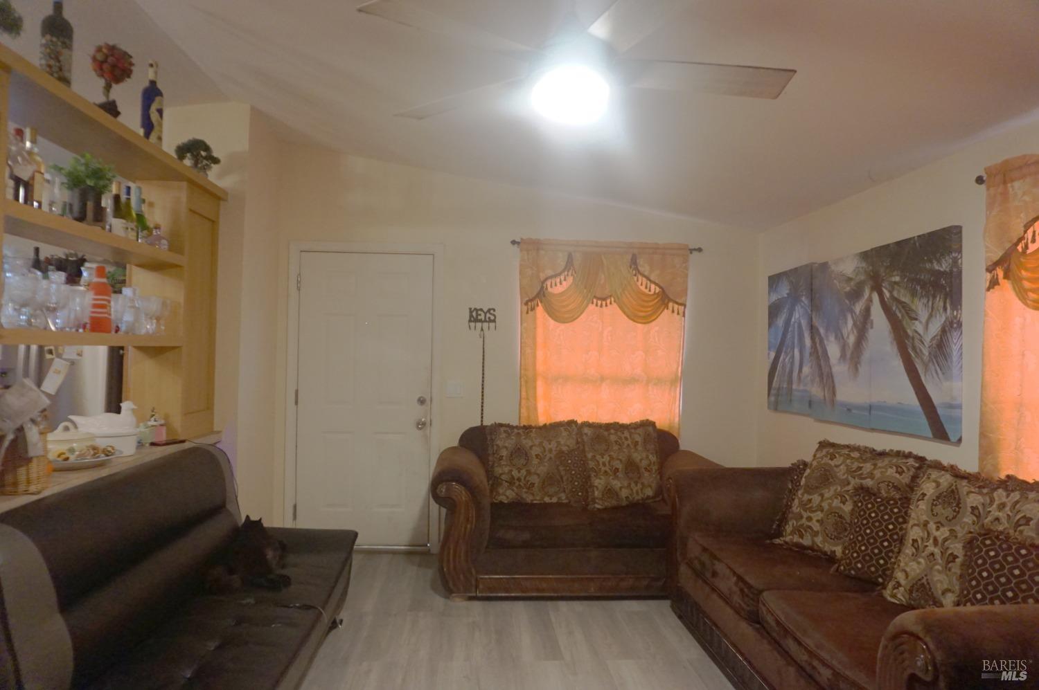 6004 Monticello Road, Unit 7 Napa, CA 94558 - Photo 9 of 33 a living room with furniture and a window
