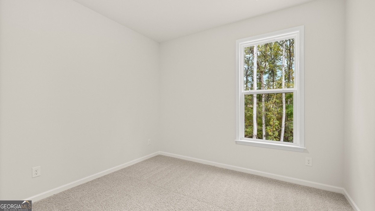 1816 Quaker Street Hampton, GA 30228 - Photo 13 of 32 an empty room with a window