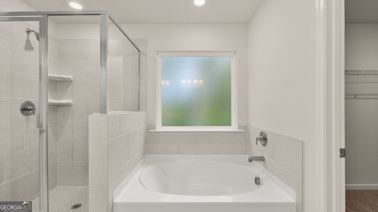 1816 Quaker Street Hampton, GA 30228 - Photo 19 of 32 a white bath tub sitting next to a shower
