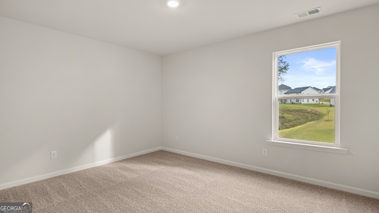 1816 Quaker Street Hampton, GA 30228 - Photo 21 of 32 a view of an empty room with a window
