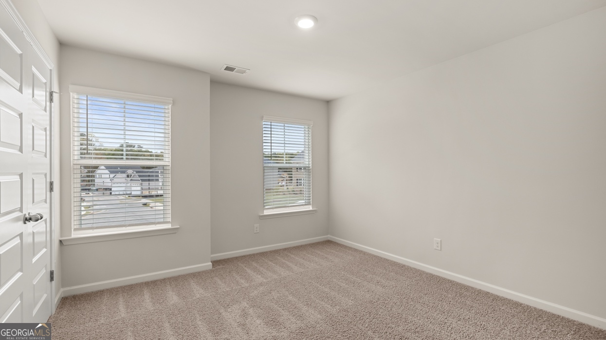 1816 Quaker Street Hampton, GA 30228 - Photo 22 of 32 a view of an empty room with a window