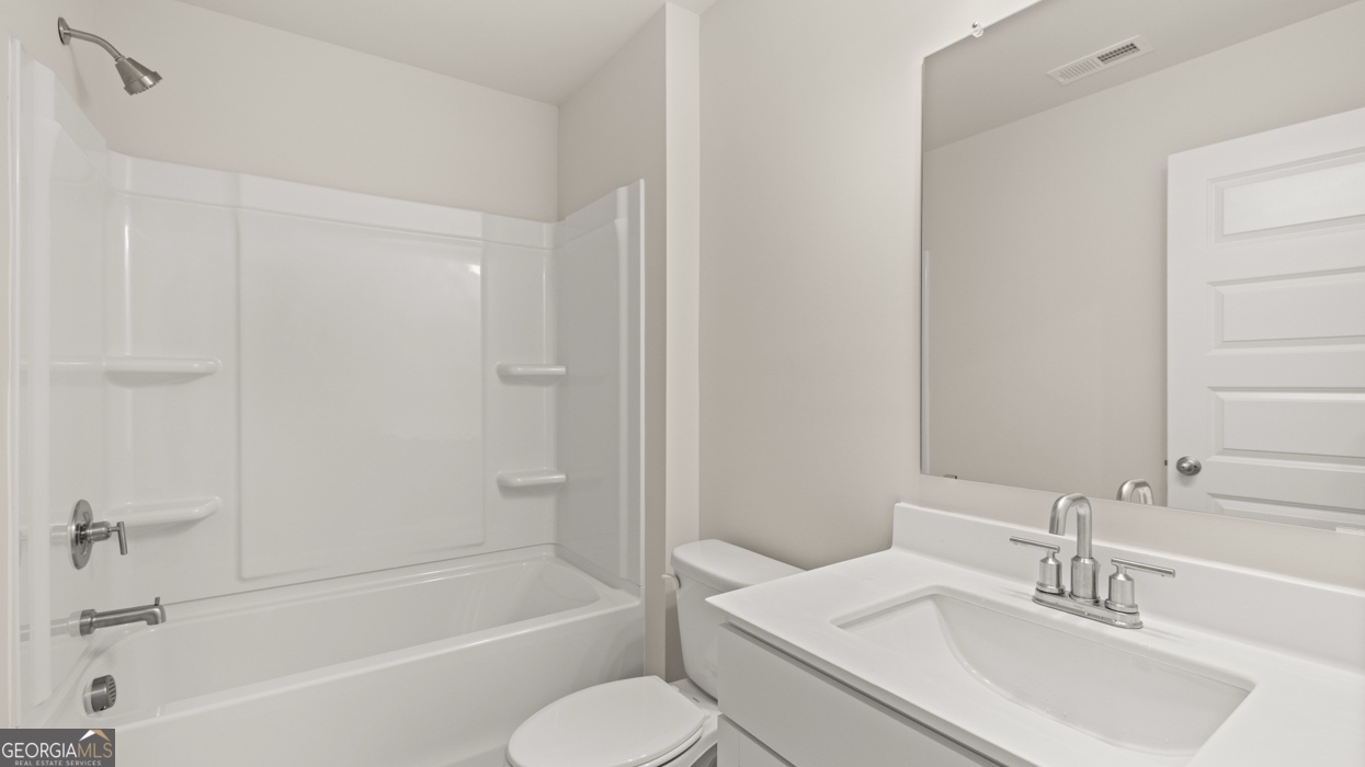 1816 Quaker Street Hampton, GA 30228 - Photo 26 of 32 a bathroom with a sink toilet and bathtub