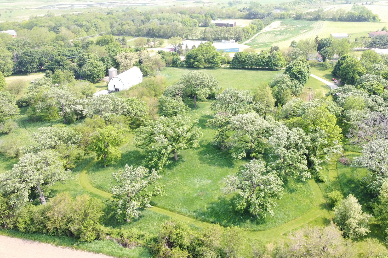 7120 East Tryon Grove Road Richmond, IL 60071 - Photo 11 of 33 a view of a lake with a city