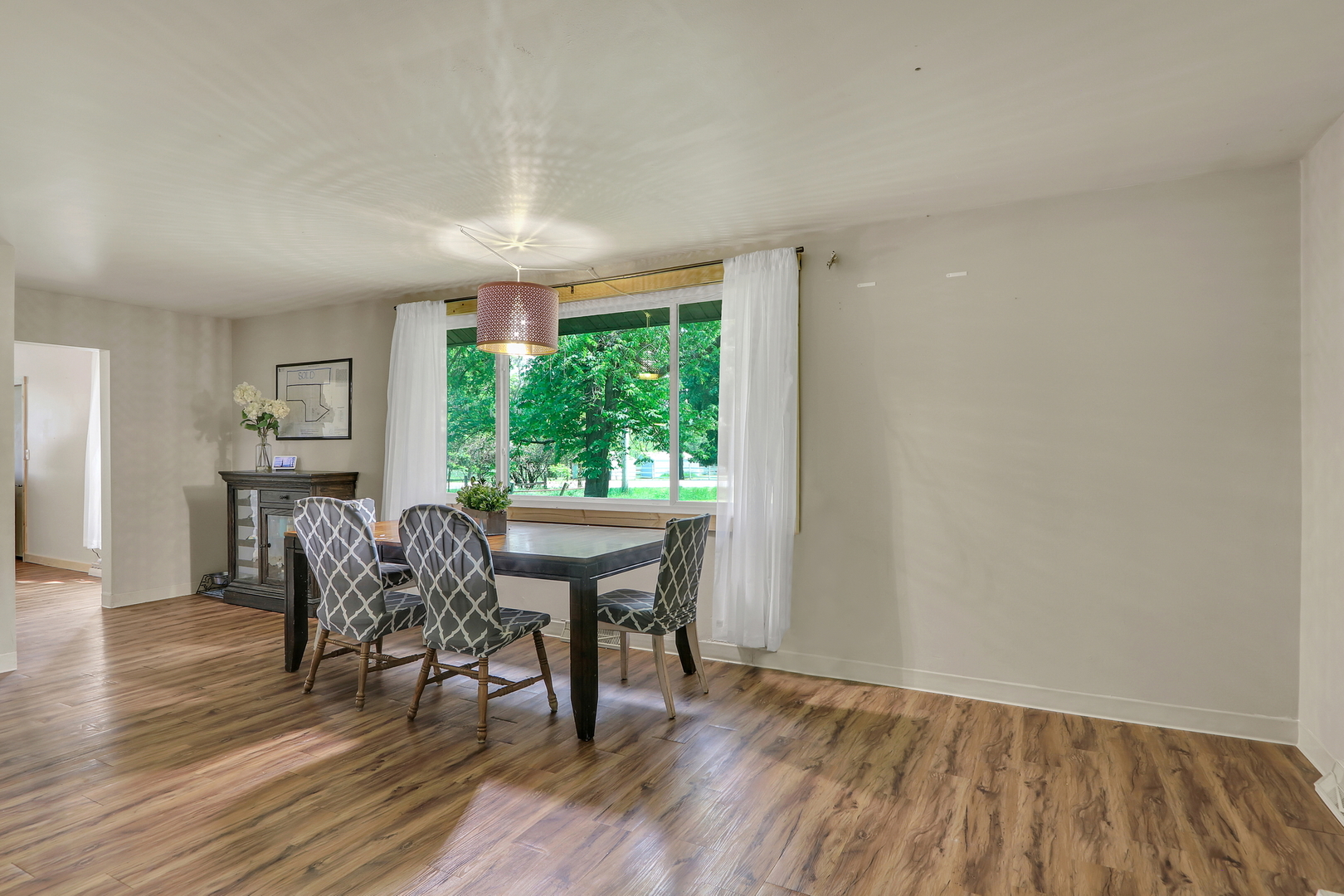 7120 East Tryon Grove Road Richmond, IL 60071 - Photo 17 of 33 a dining room with furniture and wooden floor