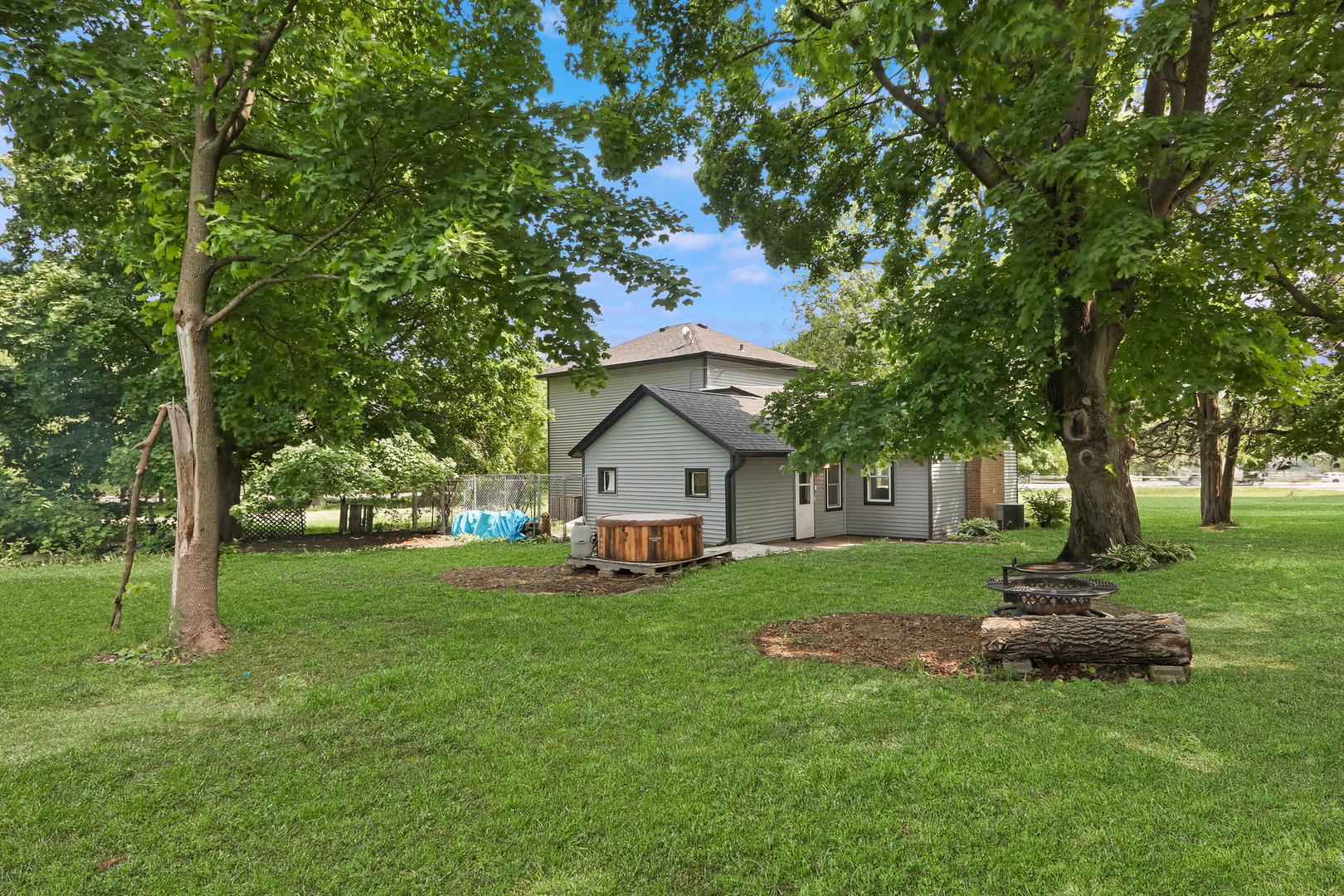 7120 East Tryon Grove Road Richmond, IL 60071 - Photo 5 of 33 a view of a house with a yard