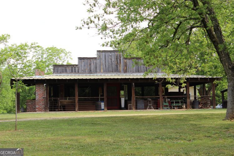 0 Shady Grove Road Hurtsboro, AL 36860 - Photo 2 of 19 a front view of a house with a garden
