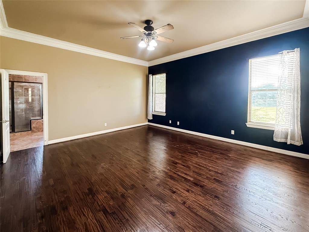 11 Fair Oaks Drive Haughton, LA 71037 - Photo 12 of 29 a view of an empty room with window and wooden floor