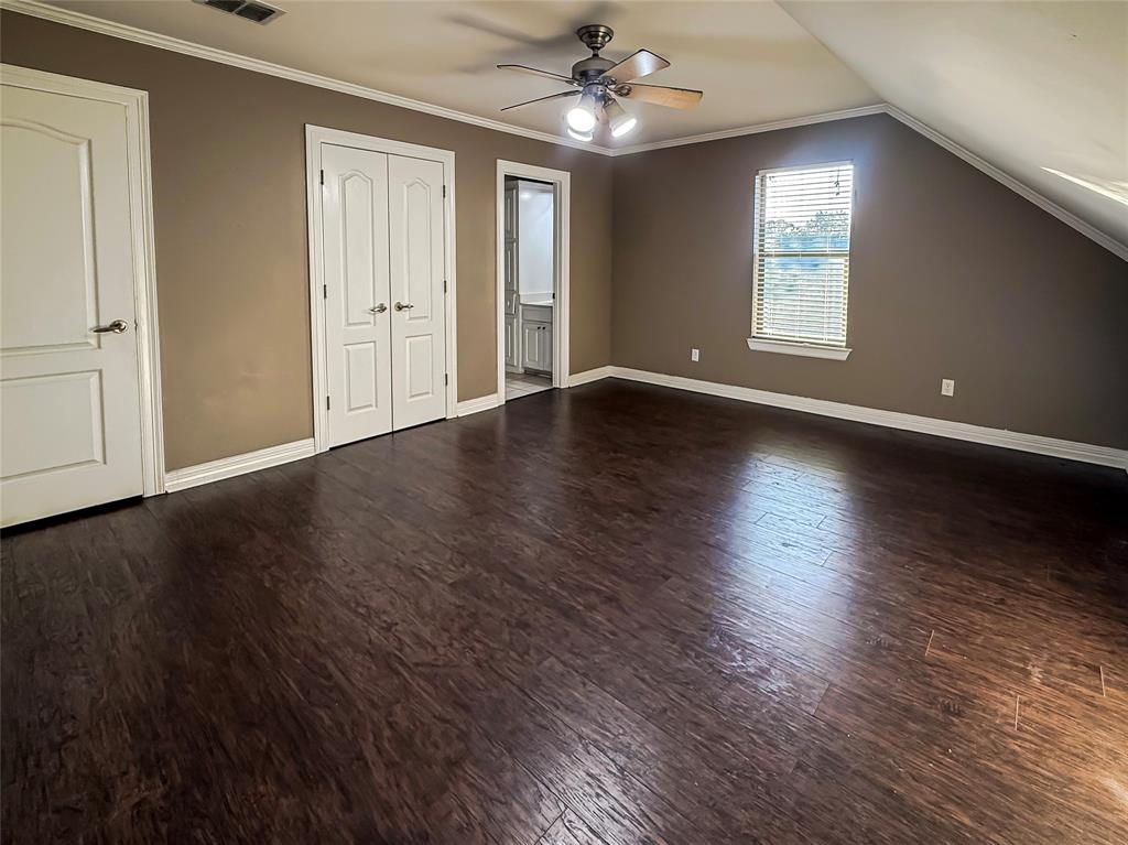 11 Fair Oaks Drive Haughton, LA 71037 - Photo 21 of 29 an empty room with wooden floor chandelier and windows