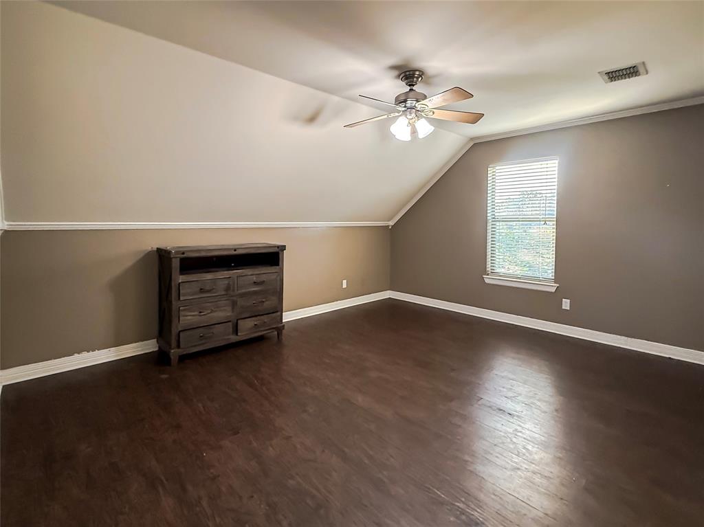 11 Fair Oaks Drive Haughton, LA 71037 - Photo 23 of 29 a view of an empty room with wooden floor and a window