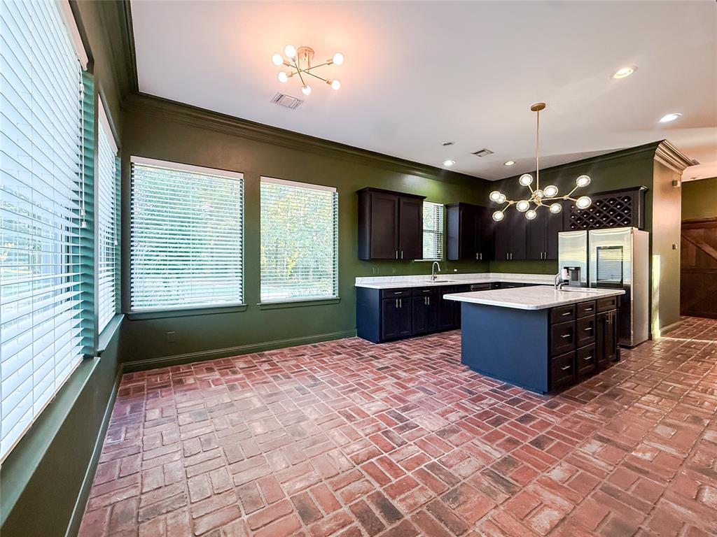 11 Fair Oaks Drive Haughton, LA 71037 - Photo 6 of 29 a large kitchen with a refrigerator and a sink