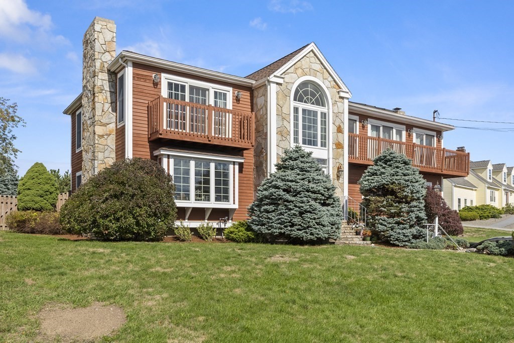 56 Skytop Road Ipswich, MA 01938 - Photo 1 of 42 a front view of a house with garden