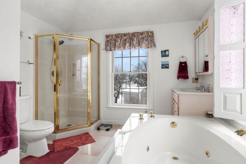 56 Skytop Road Ipswich, MA 01938 - Photo 16 of 42 a bathroom with a tub sink toilet and shower