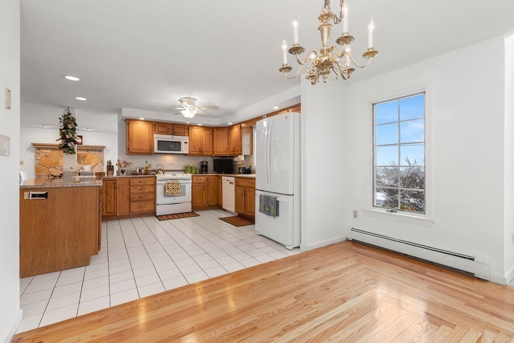 56 Skytop Road Ipswich, MA 01938 - Photo 21 of 42 a open kitchen with cabinets a sink and stainless steel appliances