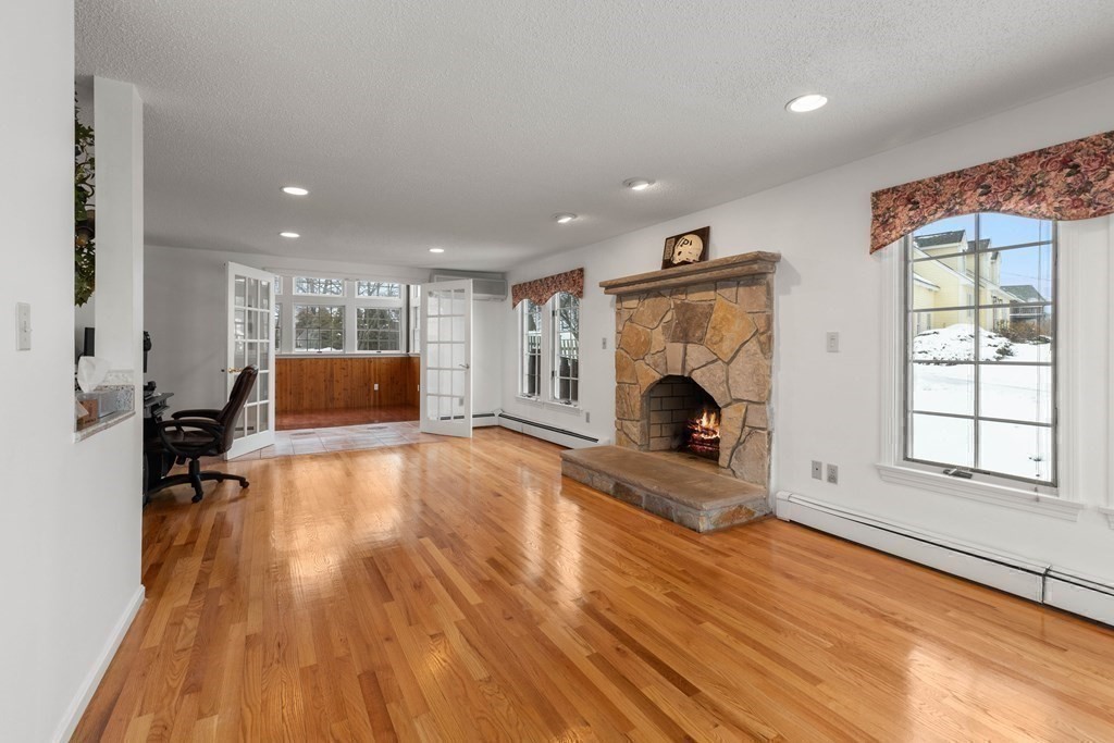 56 Skytop Road Ipswich, MA 01938 - Photo 24 of 42 a view of an empty room with wooden floor fireplace and a window