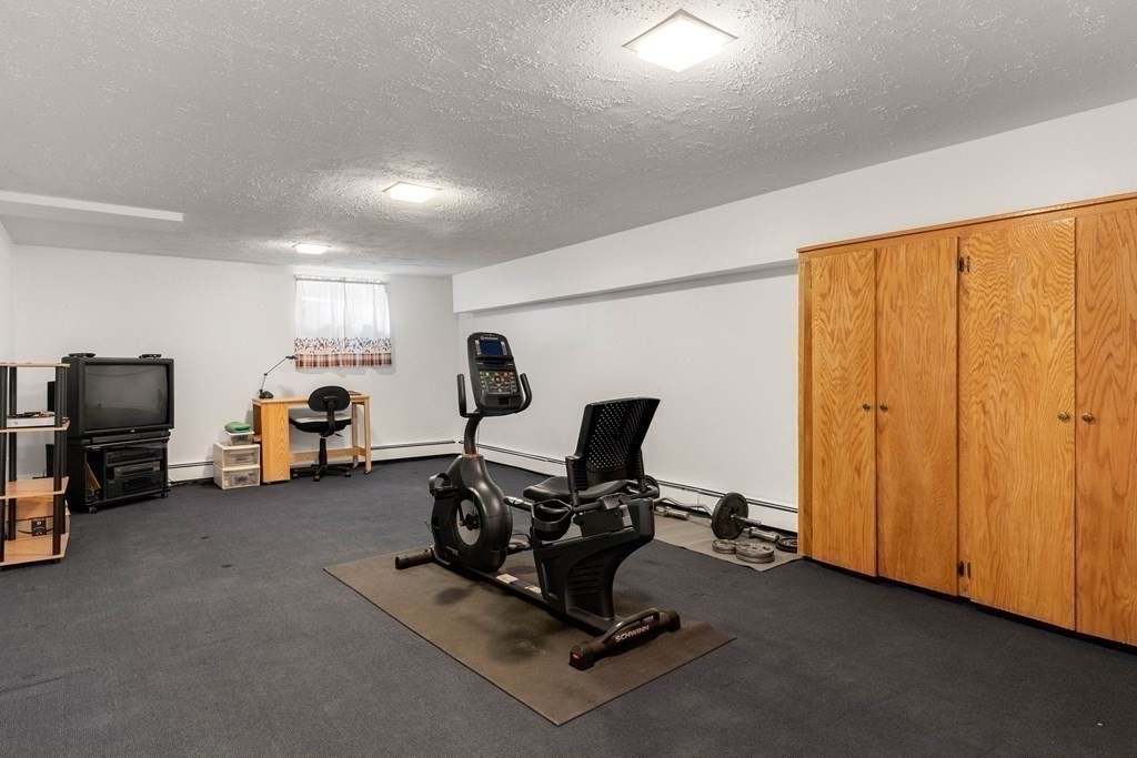 56 Skytop Road Ipswich, MA 01938 - Photo 39 of 42 a view of a room with gym equipment