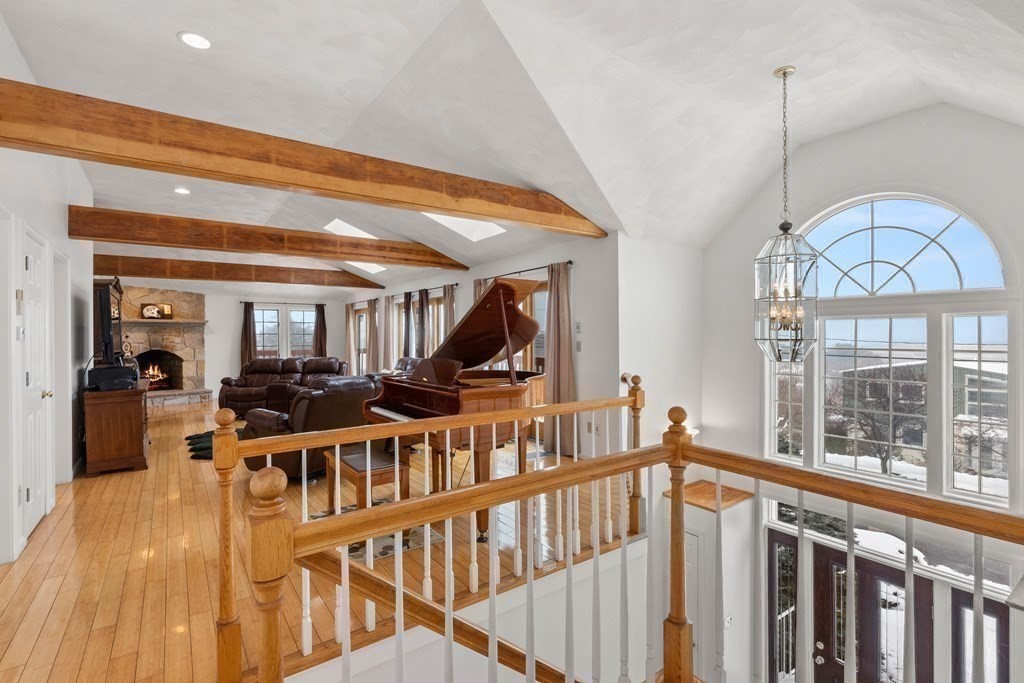 56 Skytop Road Ipswich, MA 01938 - Photo 10 of 42 a view of staircase with furniture and floor to ceiling window