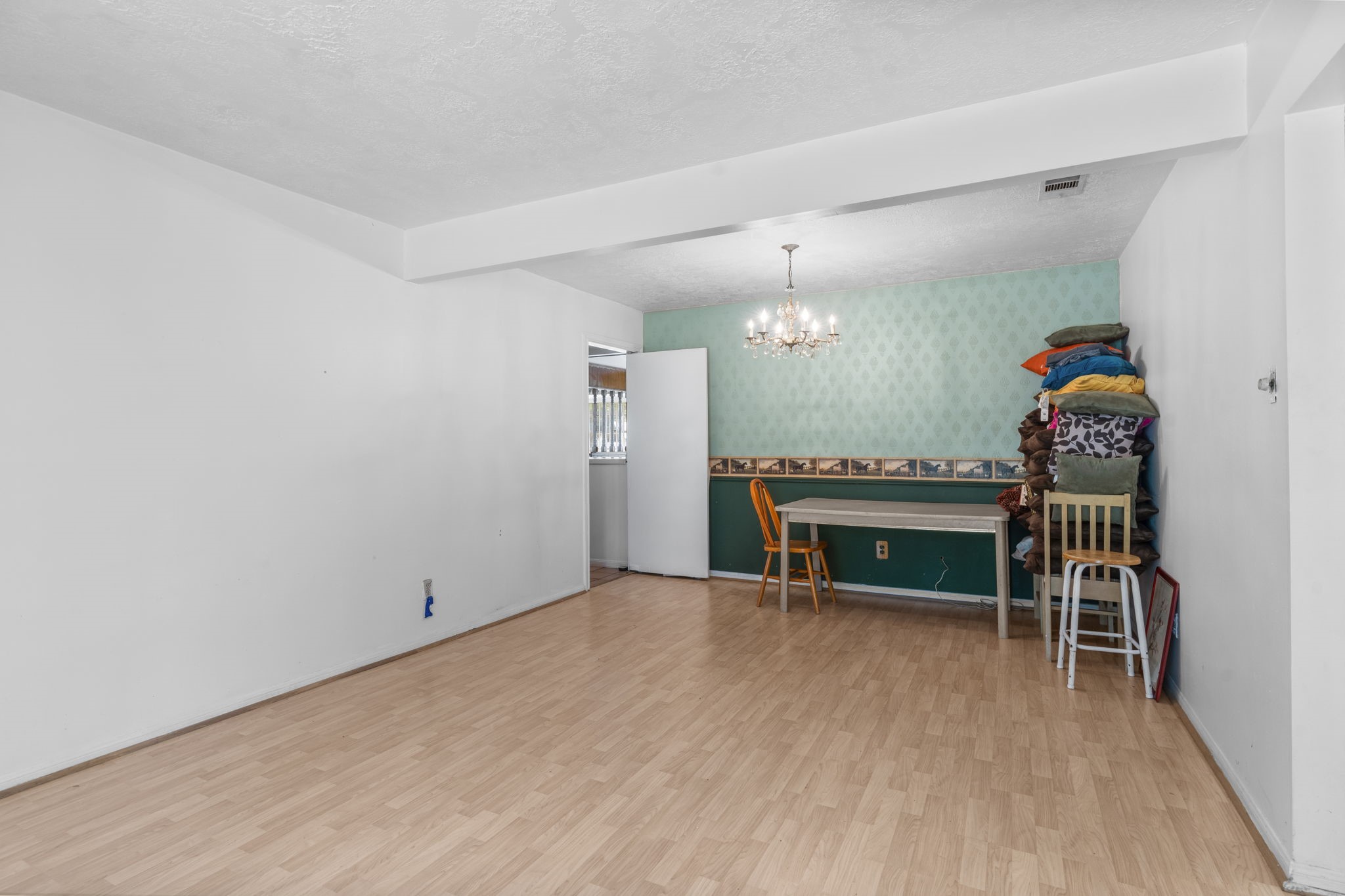 2395 Southline Road Conroe, TX 77384 - Photo 20 of 44 an empty room with wooden floor piano and windows
