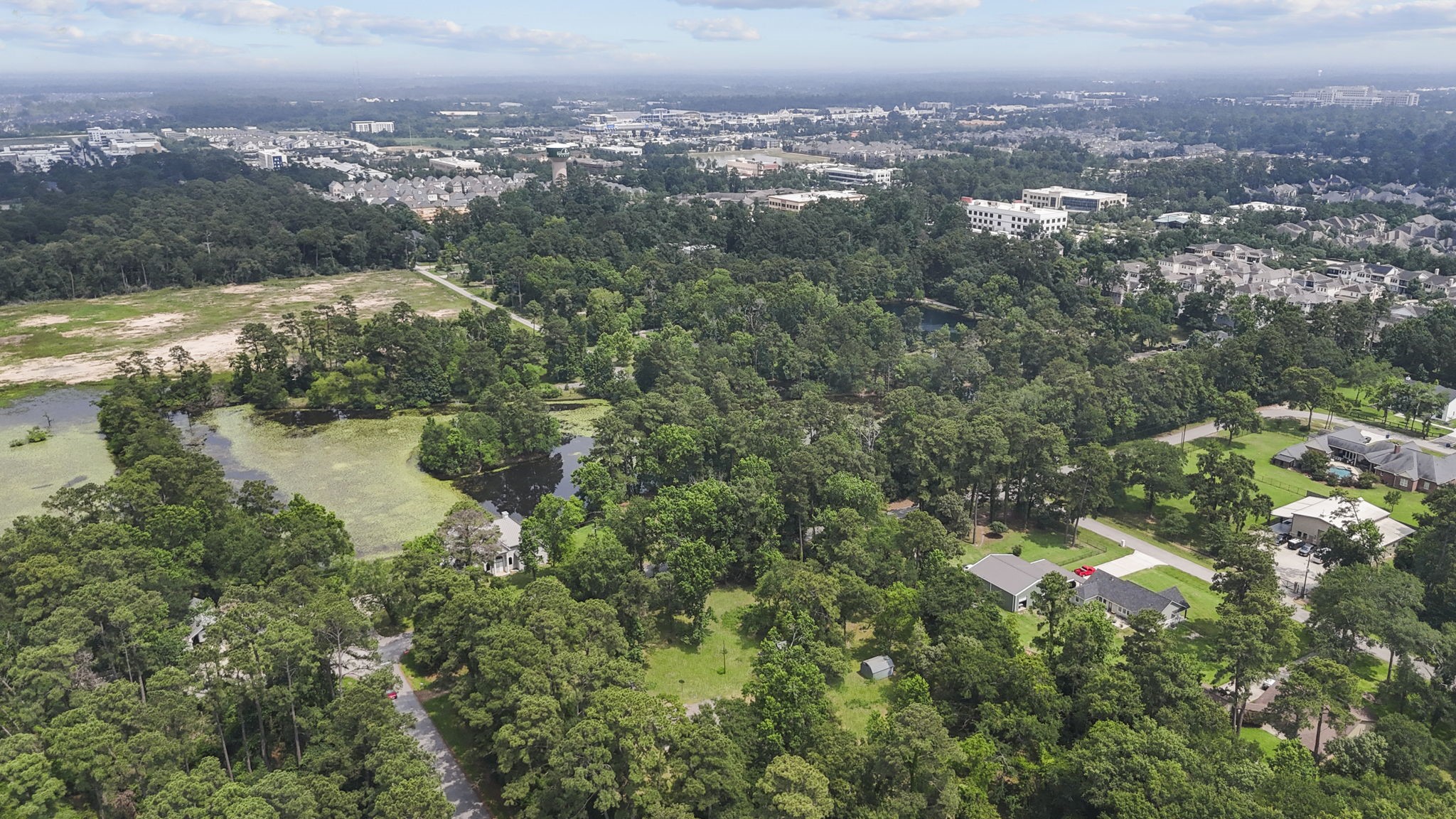 2395 Southline Road Conroe, TX 77384 - Photo 22 of 44 an aerial view of residential house with outdoor space and trees all around
