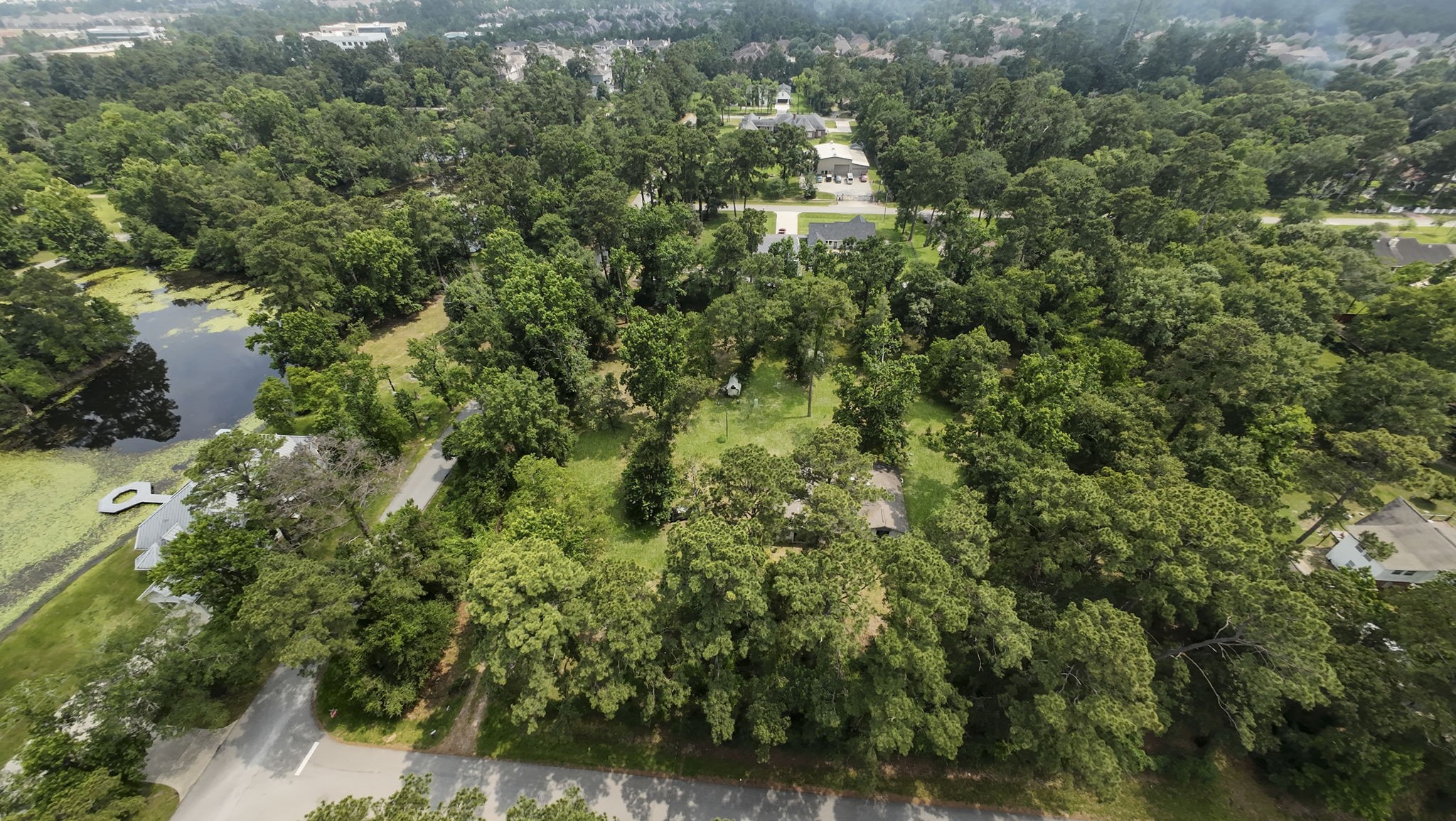 2395 Southline Road Conroe, TX 77384 - Photo 23 of 44 an aerial view of residential house with outdoor space and trees all around