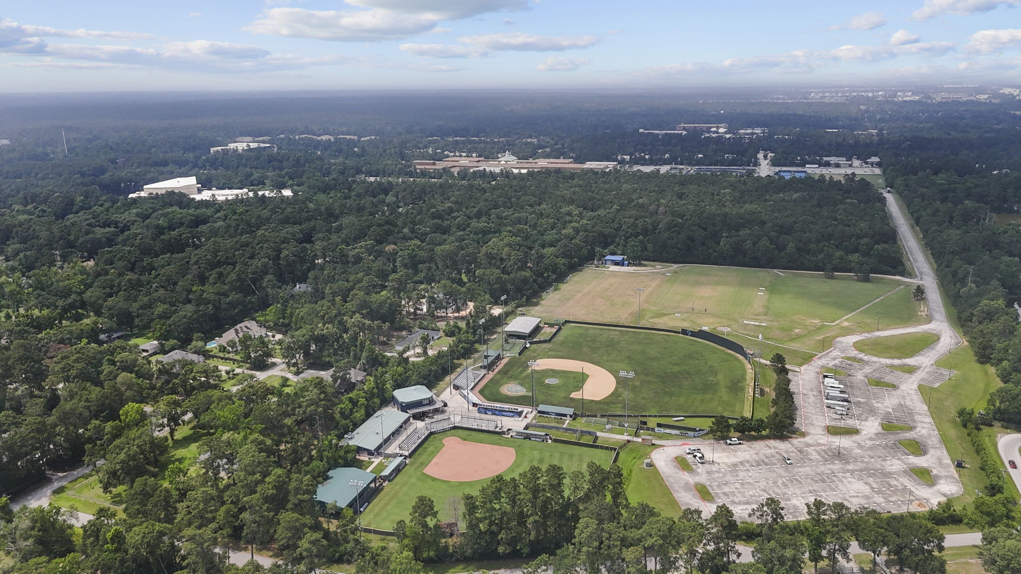 2395 Southline Road Conroe, TX 77384 - Photo 26 of 44 an aerial view of a house with a yard and lake view