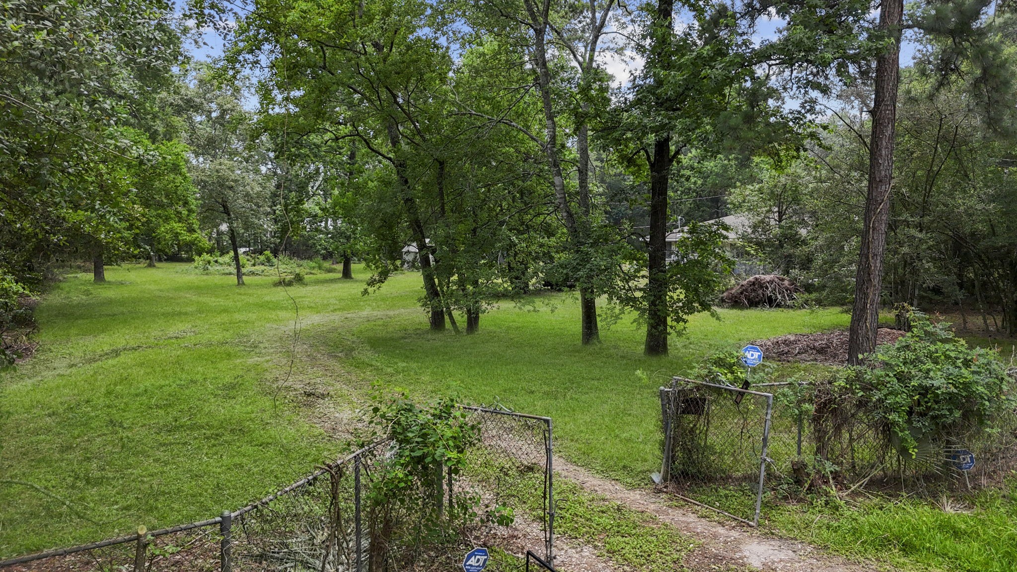 2395 Southline Road Conroe, TX 77384 - Photo 4 of 44 a view of a park with a tree
