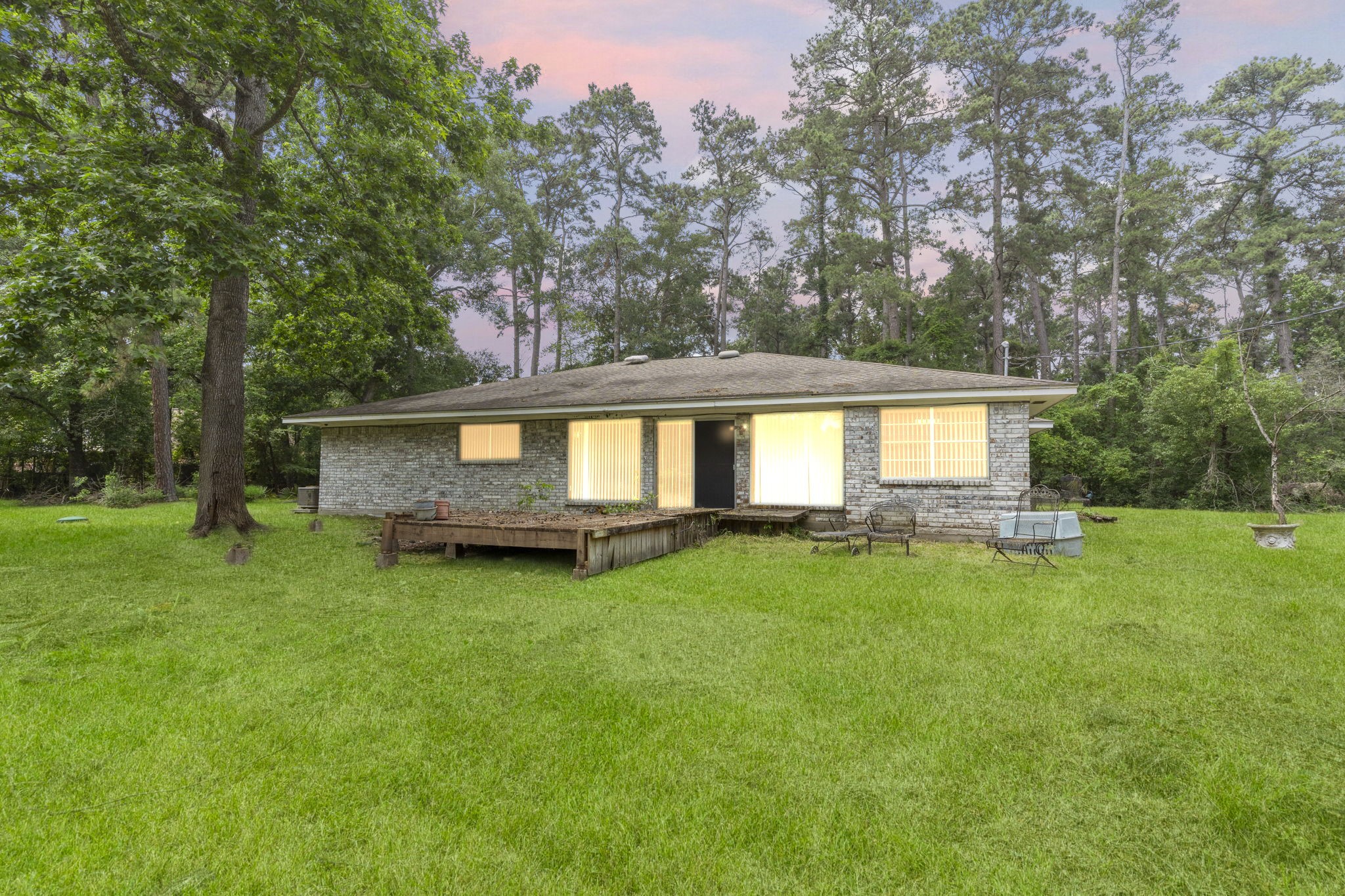 2395 Southline Road Conroe, TX 77384 - Photo 44 of 44 a view of a house with backyard and sitting area