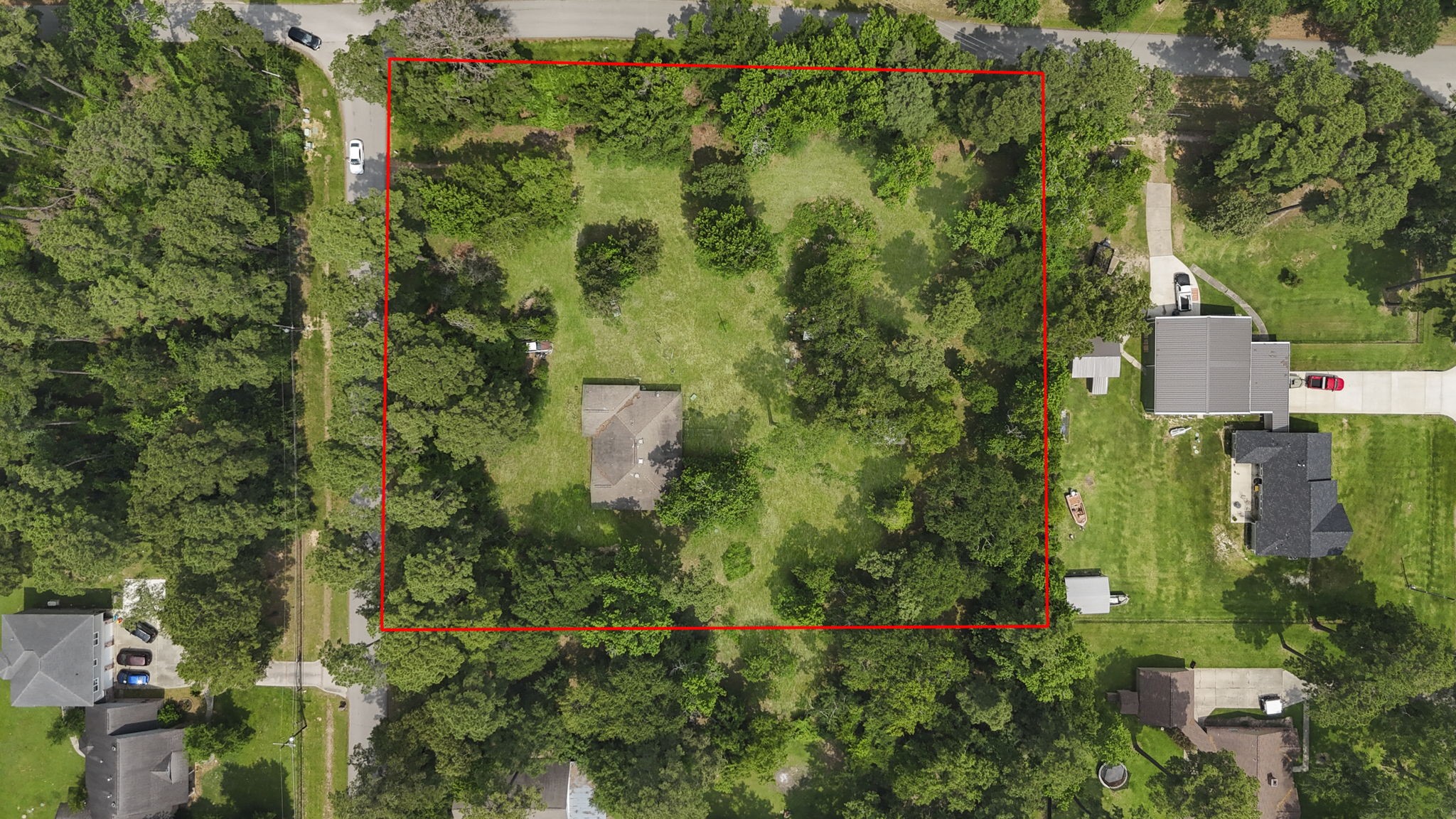 2395 Southline Road Conroe, TX 77384 - Photo 5 of 44 an aerial view of residential house with outdoor space and trees all around