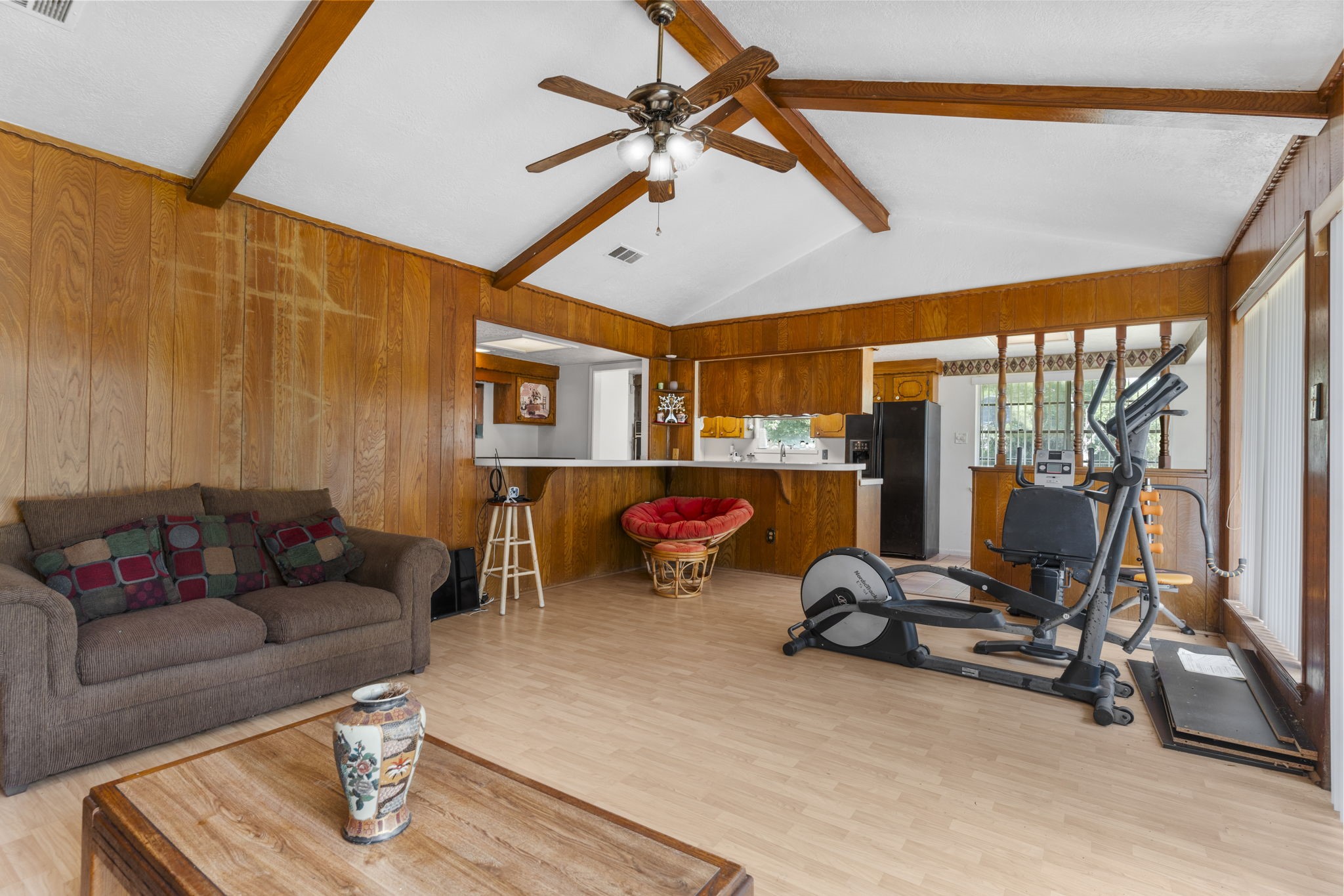2395 Southline Road Conroe, TX 77384 - Photo 6 of 44 a living room with furniture gym equipment and a large window