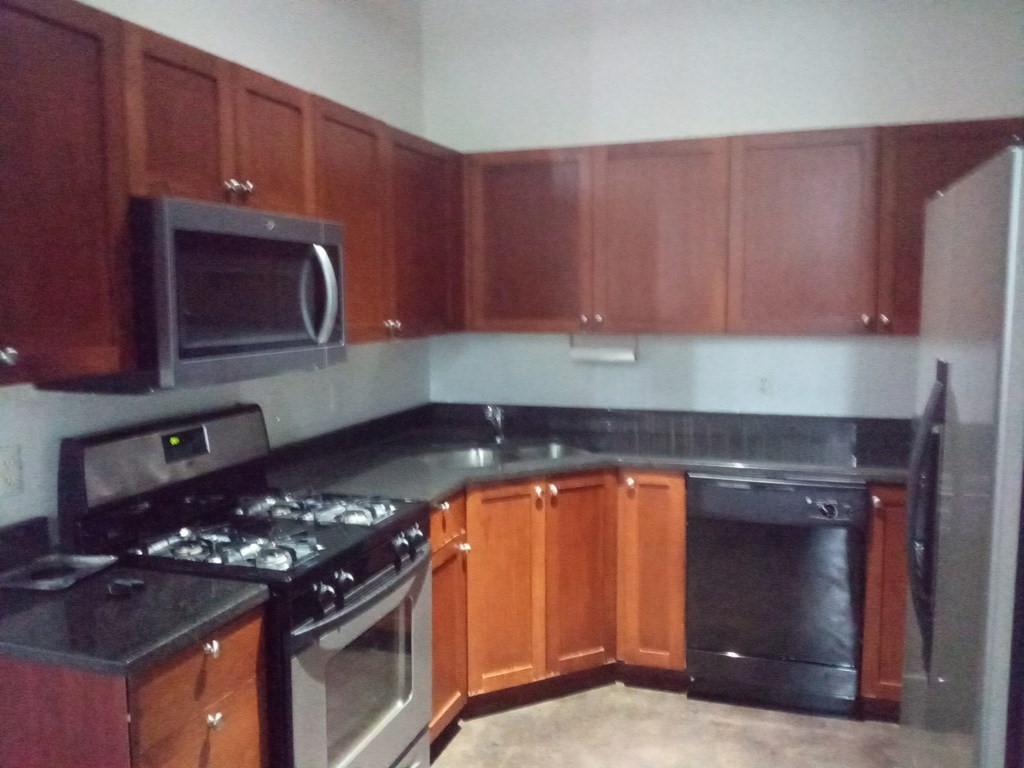 a kitchen with a stove and a microwave