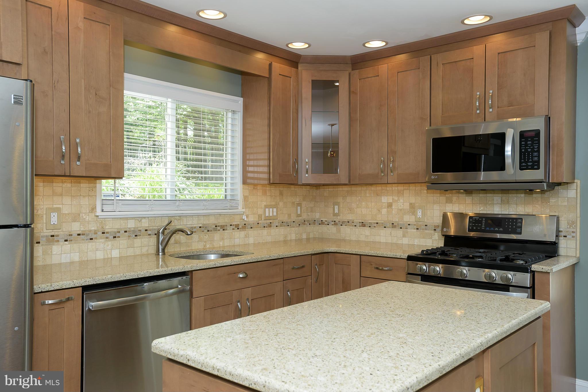 100 Shortcross Road Linthicum Heights, MD 21090 - Photo 12 of 30 a kitchen with a sink and a stove top oven