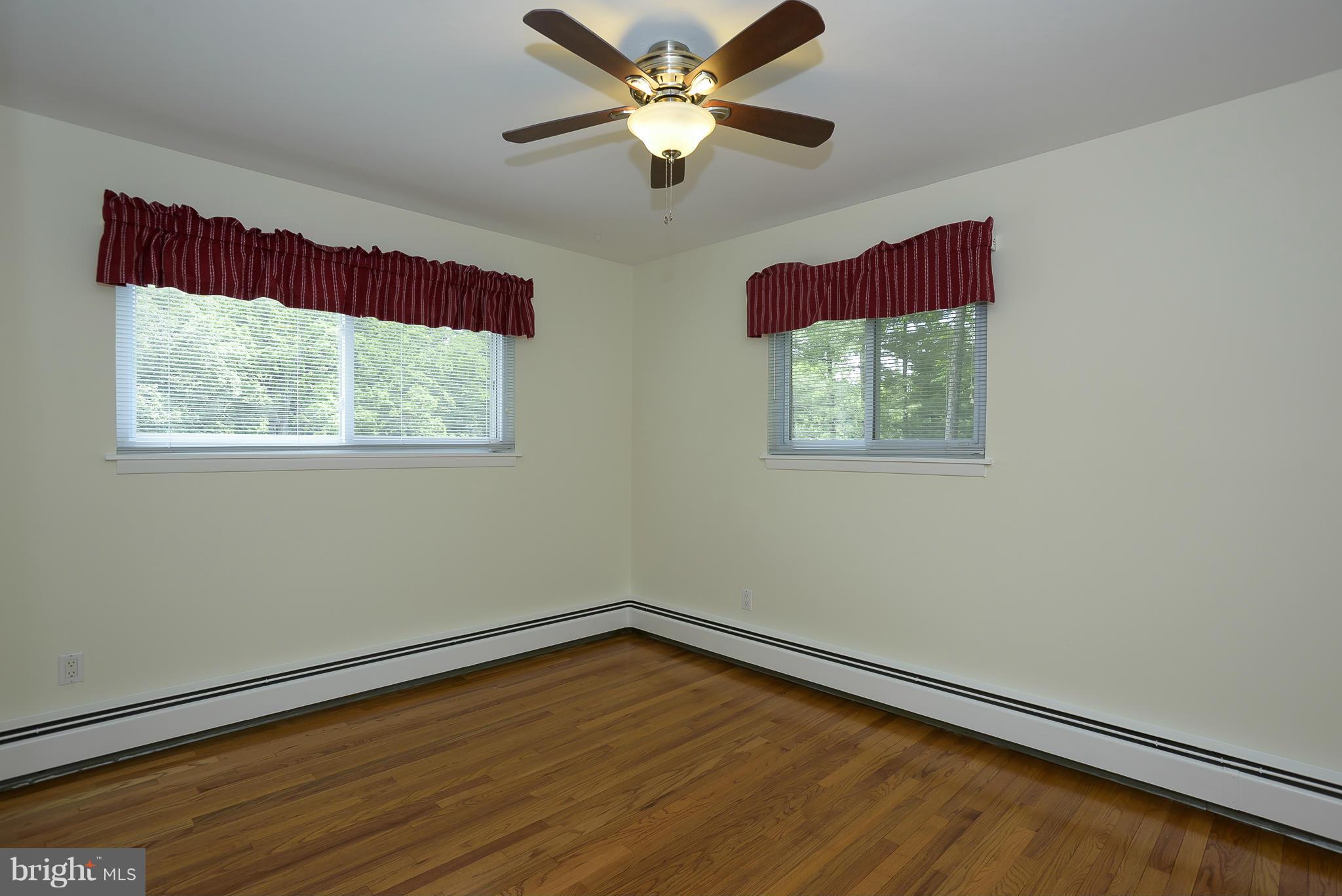 100 Shortcross Road Linthicum Heights, MD 21090 - Photo 15 of 30 a view of a room with wooden floor and a window