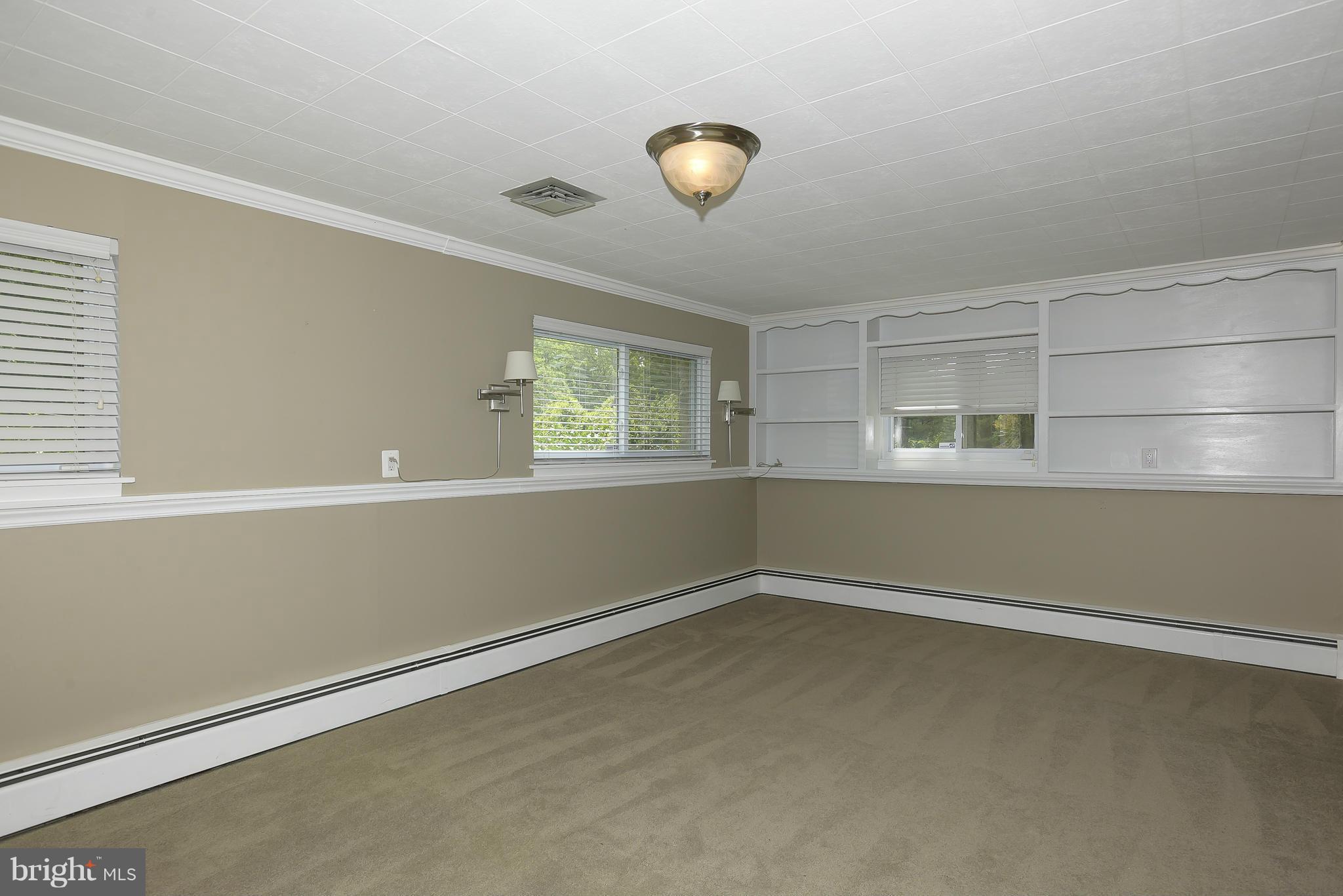 100 Shortcross Road Linthicum Heights, MD 21090 - Photo 18 of 30 an empty room with a empty space and windows