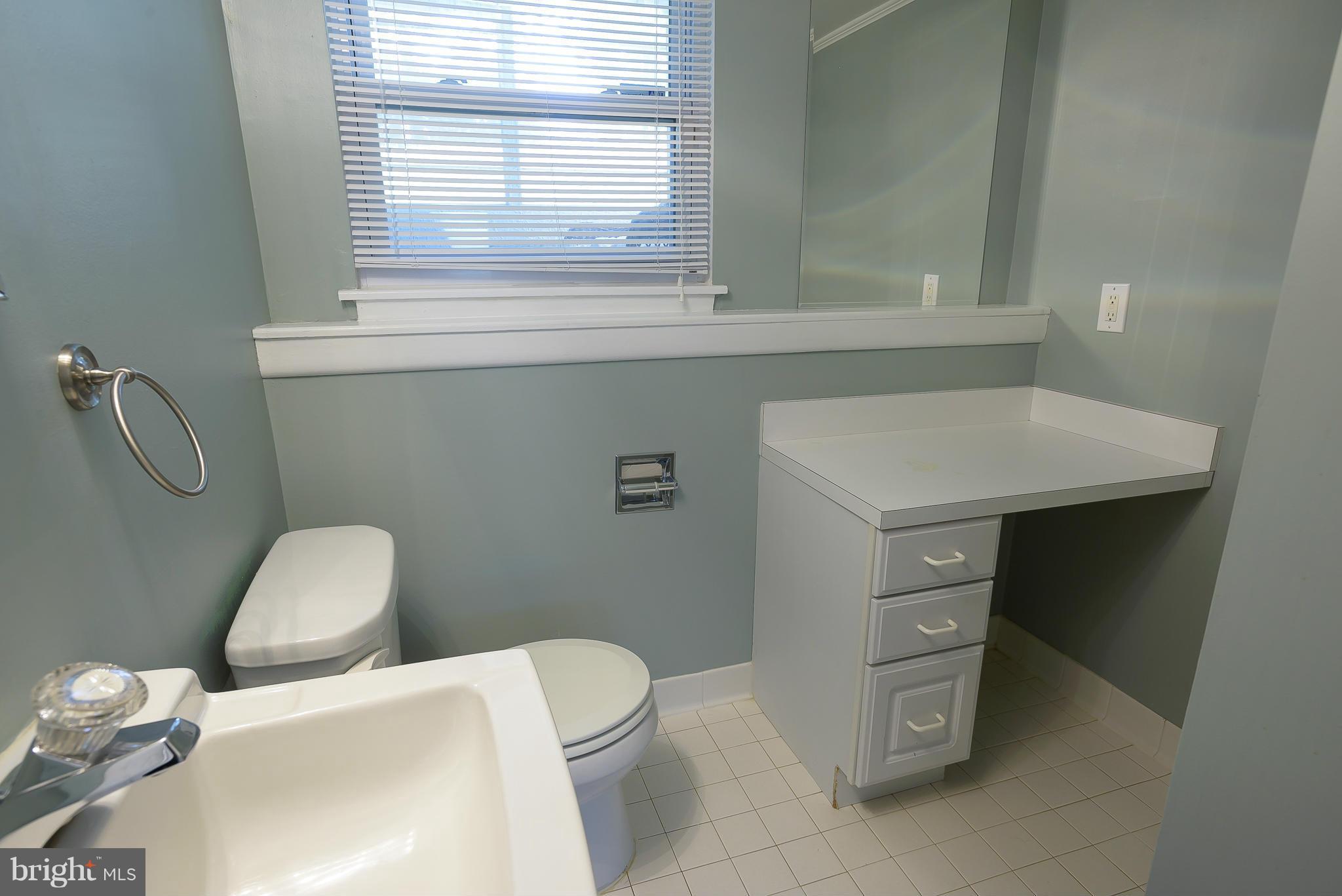 100 Shortcross Road Linthicum Heights, MD 21090 - Photo 20 of 30 a bathroom with a toilet sink and mirror