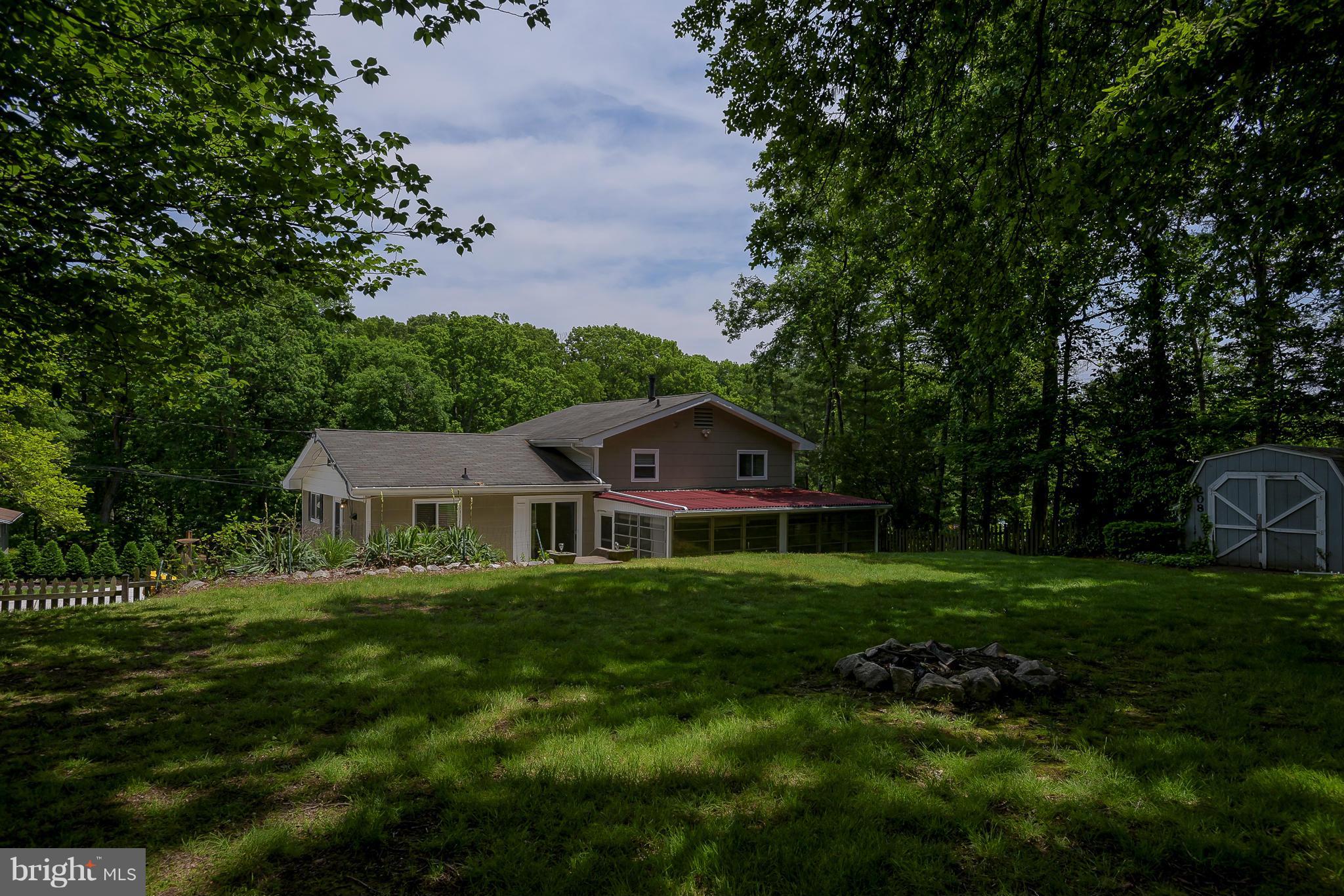 100 Shortcross Road Linthicum Heights, MD 21090 - Photo 25 of 30 a front view of a house with a yard