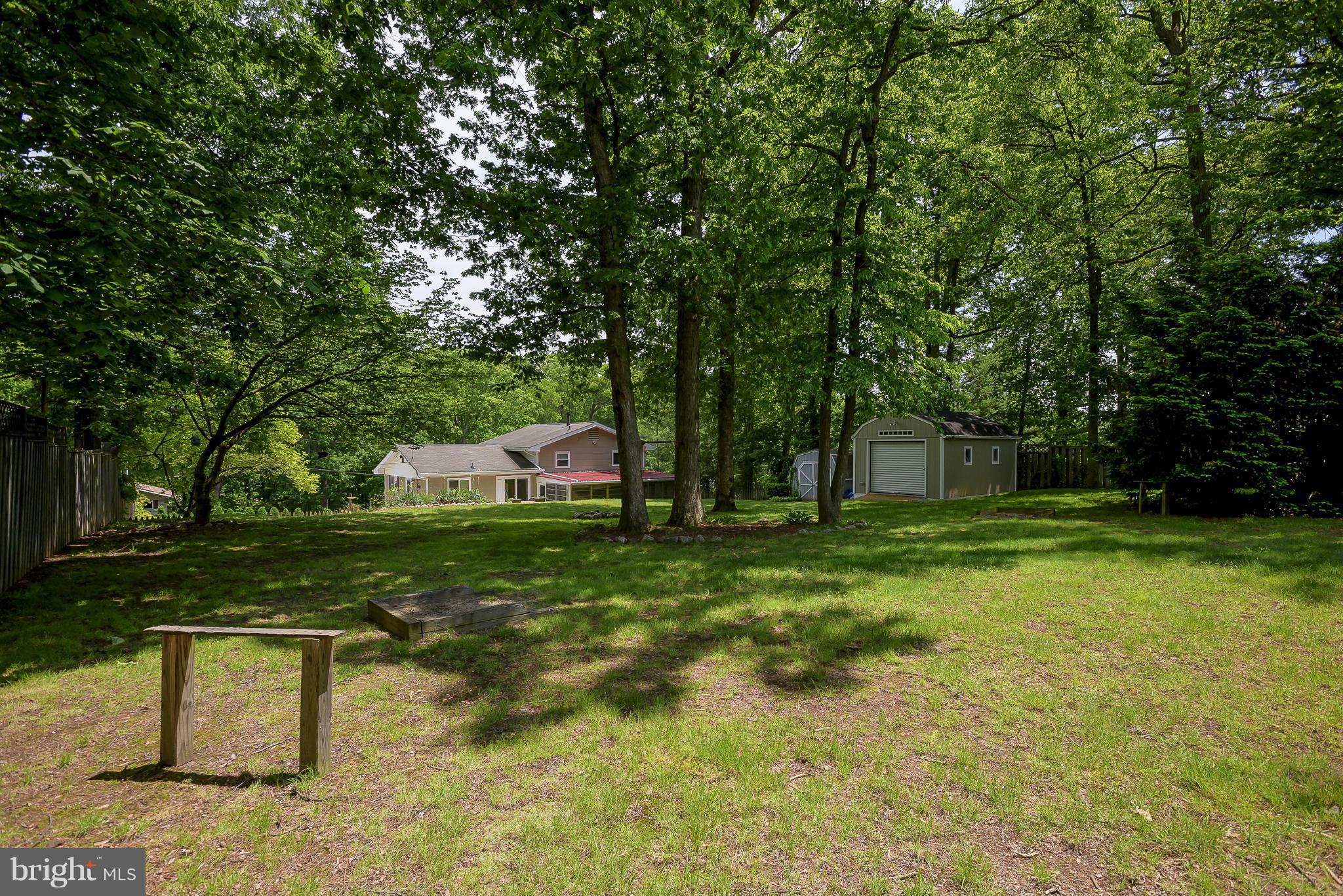 100 Shortcross Road Linthicum Heights, MD 21090 - Photo 27 of 30 a front view of a house with a yard and tree