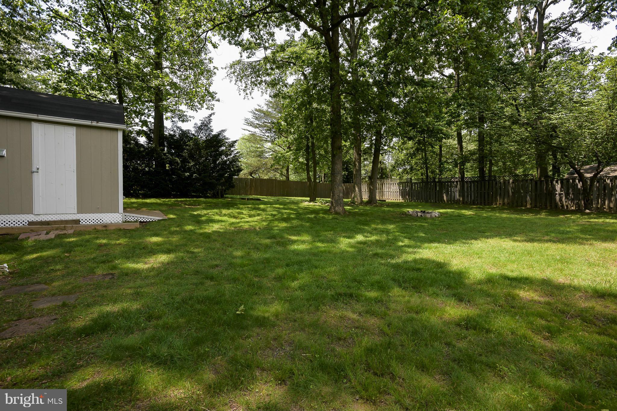 100 Shortcross Road Linthicum Heights, MD 21090 - Photo 28 of 30 a backyard of a house with lots of green space