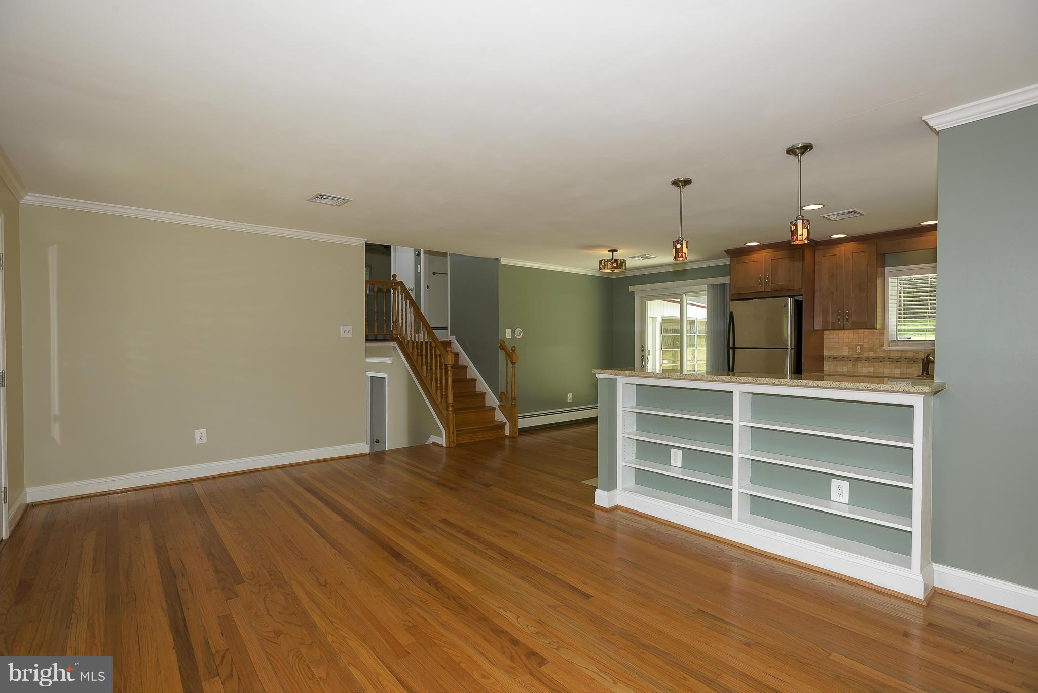 100 Shortcross Road Linthicum Heights, MD 21090 - Photo 4 of 30 a view of a room with wooden floor and stairs